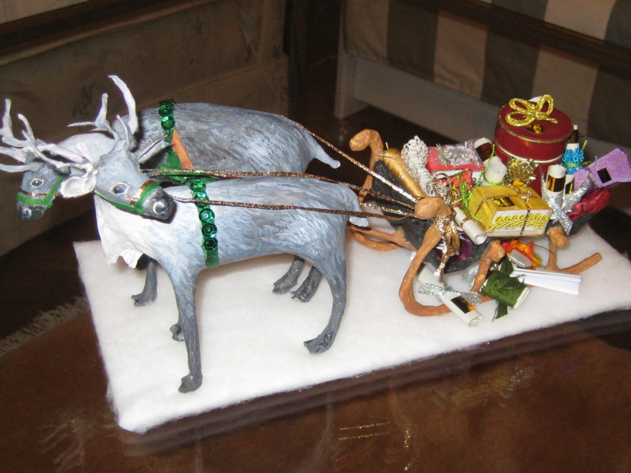 Adventkalender, Rentiere mit Geschenkschlitten